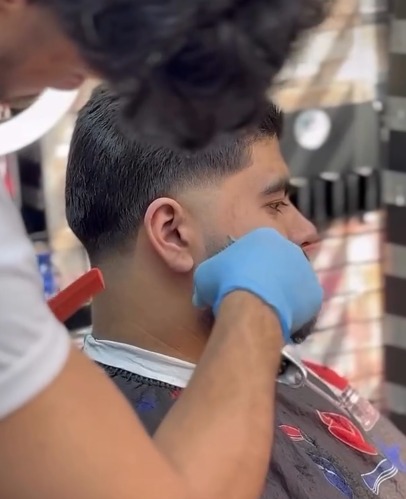 Razor-sharp beard outline and fade blend